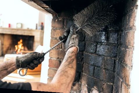 Close brushwork inside a firebox before hearth repair